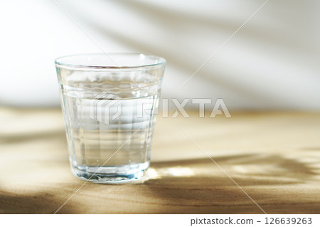 Cold water on a table in the sun 126639263