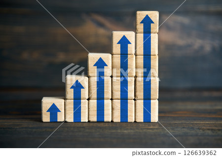 Wooden blocks stacked as blue arrow bar chart Wooden blocks stacked as blue arrow bar chart 126639362