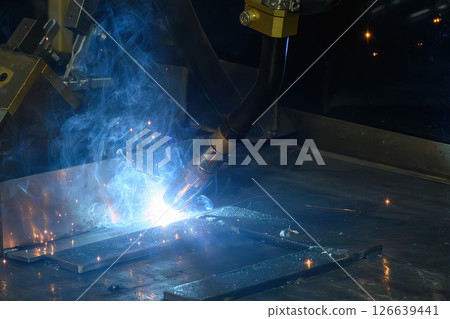 Close up scene the laser welding process by robotic system. 126639441
