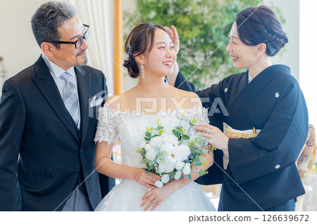 Bride and parents wedding 126639672