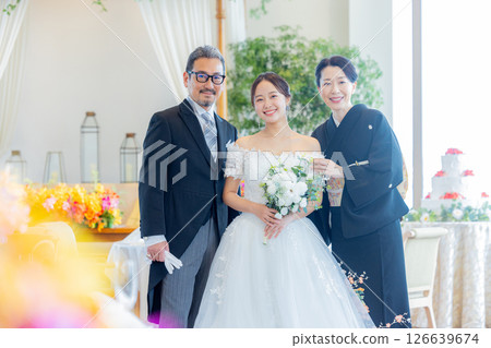 Bride and parents wedding 126639674