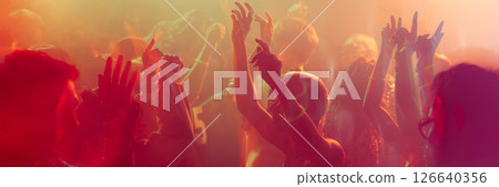 Vibrant nightclub scene with people dancing, colorful lights, hands up, and energetic atmosphere. Banner. Vibrant nightclub scene with people dancing, colorful lights, hands up, and energetic atmosphere. Banner. 126640356
