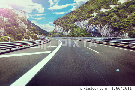 Road or highway between the mountains 126642611