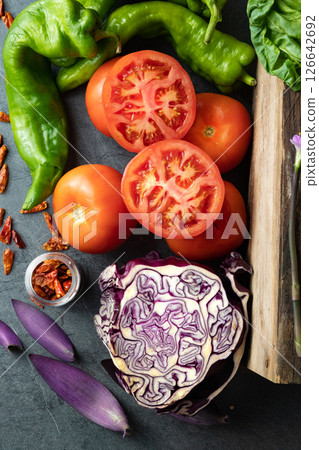 A variety of vegetables including tomatoes, onions, and green beans. A variety of vegetables including tomatoes, onions, and green beans. 126642692