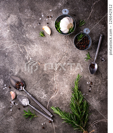 Rosemary, garlic, salt and pepper. 126642912