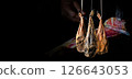 Dry Spanish ham, Jamon Serrano, Bellota, Italian Prosciutto Crudo or Parma ham. 126643053