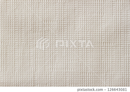Closeup of beige fabric texture with subtle grid pattern and soft fiber structure. Concept of natural textile background, minimal design, woven surface detail, minimal natural texture 126643081