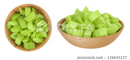 fresh celery in wooden bowl isolated on white background. Top view. Flat lay fresh celery in wooden bowl isolated on white background. Top view. Flat lay 126643257
