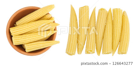 Pickled young baby corn cobs in wooden bowl isolated on white background. Top view. Flat lay Pickled young baby corn cobs in wooden bowl isolated on white background. Top view. Flat lay 126643277