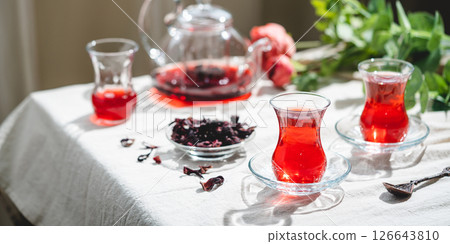 Hot red karkade tea Hot red karkade tea 126643810