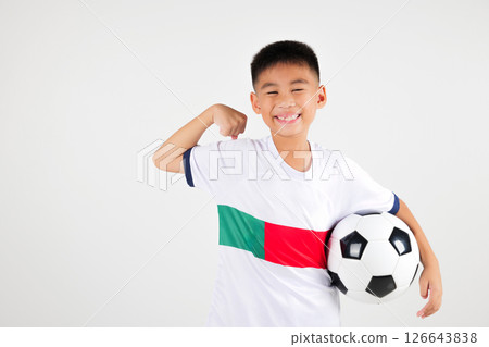 Portrait Asian smiling young boy kids holding soccer ball and power strong studio shot isolated white background, cute child playing football show muscle, sport hobby for kids, leisure games 126643838