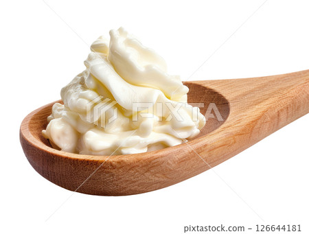 Wood spoon with sour cream 126644181