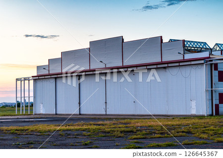 Aviation hangar outside on summer evening 126645367