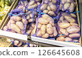 Fresh potatoes packed in bags selling at the grocery store 126645608