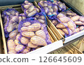Fresh potatoes packed in bags selling at the grocery store 126645609