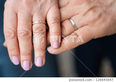 Married mature old couple holding hands with rings ceremony wedding day 126645647