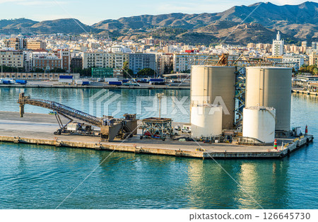 Industrial Silos and Loading Equipment at Port of Malaga. Coastal Infrastructure in Southern Spain Industrial Silos and Loading Equipment at Port of Malaga. Coastal Infrastructure in Southern Spain 126645730