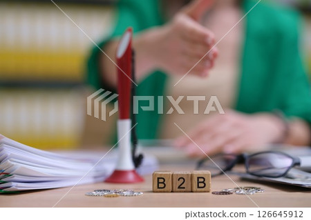 A businesstobusiness meeting that includes a professional handshake is quite significant A businesstobusiness meeting that includes a professional handshake is quite significant 126645912