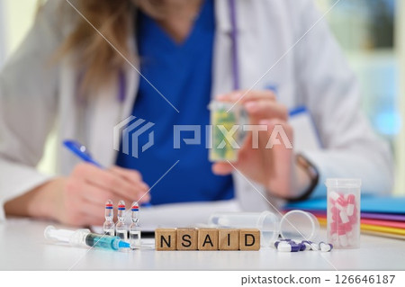 A qualified Healthcare Professional is meticulously analyzing various NSAID samples in a laboratory A qualified Healthcare Professional is meticulously analyzing various NSAID samples in a laboratory 126646187
