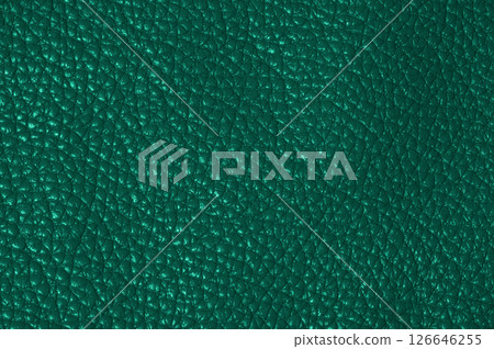 Close-up of dark green leather texture with grainy surface Close-up of dark green leather texture with grainy surface 126646255