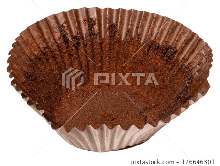 Close up of empty brown paper cupcake or muffin tin with chocolate residue, isolated background Close up of empty brown paper cupcake or muffin tin with chocolate residue, isolated background 126646301