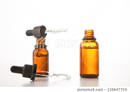 Aromatherapy brown open dropper bottles mockups. 126647359