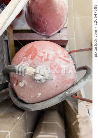 top view of dust covered fire extinguishers 126647589