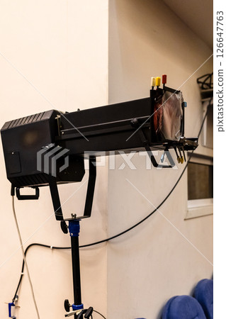 spotlight in auditorium of theater spotlight in auditorium of theater 126647763