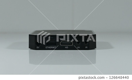 The back panel of a set top box with different connectors and slots for connection 126648440