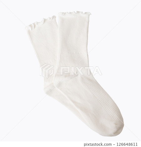 White cotton socks with ruffled edges on clean white background White cotton socks with ruffled edges on clean white background 126648611