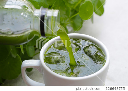 Herbal juice drink, Fresh green centella asiatica leaves or water pennywort plant or gotu kola. Herbal juice drink, Fresh green centella asiatica leaves or water pennywort plant or gotu kola. 126648755
