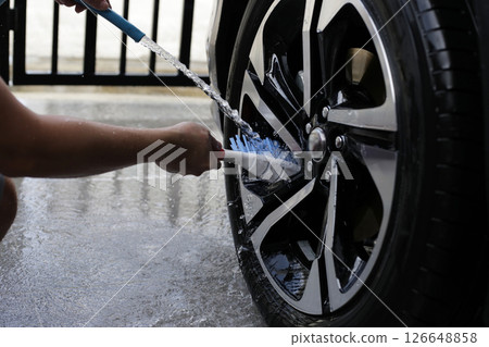 Washing car, cleaning tires and wheels Washing car, cleaning tires and wheels 126648858