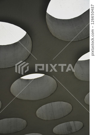 Round skylights in rows in a concrete ceiling, modern architecture 126650487