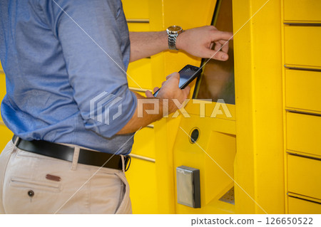 Modern Delivery Locker with User Accessing Package for efficiency and effectiveness 126650522