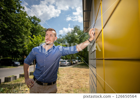 A Confident Young Man Posing Outdoors in a Stylish Shirt, Radiating Charm and Style 126650564
