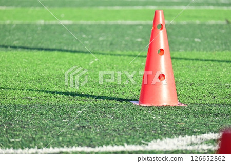 artificial green grass soccer field with orange training cones artificial green grass soccer field with orange training cones 126652862