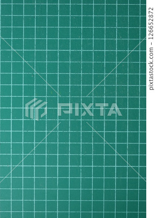 green cutting mat board background with line and scale measure guide pattern for object art design 126652872