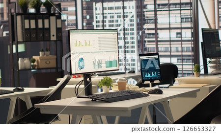 Empty business office with cubicles used in organizational activity efficiency, having advanced tech gadgets to serve a corporation with luxurious city center headquarters. Corporate culture. Empty business office with cubicles used in organizational activity efficiency, having advanced tech gadgets to serve a corporation with luxurious city center headquarters. Corporate culture. 126653327