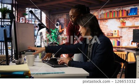 Programmer coming to AI startup office CTO manager desk to request help. Employee asks questions to senior team leader in artificial intelligence software development agency, camera B Programmer coming to AI startup office CTO manager desk to request help. Employee asks questions to senior team leader in artificial intelligence software development agency, camera B 126653332