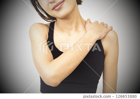 A woman suffering from stiff shoulders 126653880