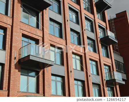 Contemporary Modern Brick Apartment Building Featuring Stylish and Elegant Glass Balconies 126654217