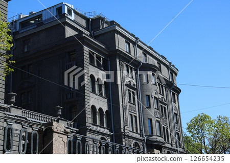 Stunningly Imposing Black Architecture Set Against a Vast and Clear Blue Sky Above Stunningly Imposing Black Architecture Set Against a Vast and Clear Blue Sky Above 126654235