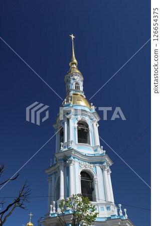 An Elegant Tower Stands Majestically Under a Clear Blue Sky, Showcasing Artistic Beauty and Design An Elegant Tower Stands Majestically Under a Clear Blue Sky, Showcasing Artistic Beauty and Design 126654375