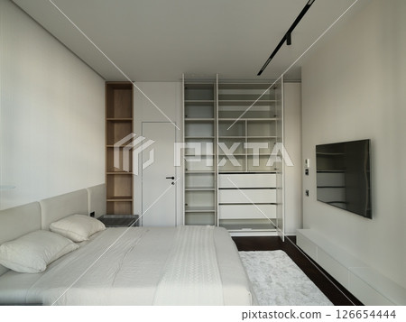 A beautifully designed Modern Minimalist Bedroom with a sleek style promoting relaxation 126654444