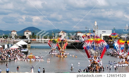 A festival scene where people enter the river and carry the portable shrine. A festival scene where people enter the river and carry the portable shrine. 126654520