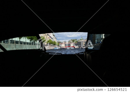 A stunning cityscape view from inside a vehicle traveling along a picturesque waterway A stunning cityscape view from inside a vehicle traveling along a picturesque waterway 126654521