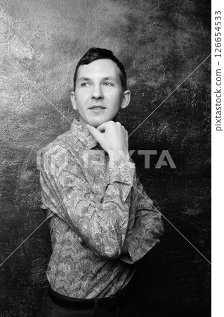 A Thoughtful Portrait of a Distinguished Man Dressed in a Classy Patterned Shirt 126654533