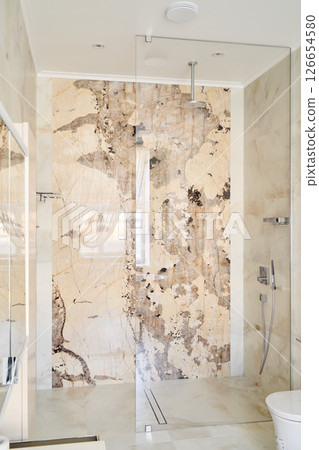 Discover a Modern Luxurious Shower Space Featuring an Elegant Stone Wall Design with Style 126654580