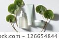 Flat lay of aligned Centella asiatica (CICA) cosmetics and leaves (beauty and cosmetics) 126654844