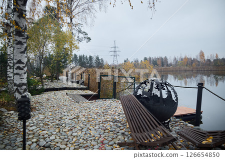 A Serene Autumn Landscape View by the Water with a Beautiful Balance of Rustic Nature A Serene Autumn Landscape View by the Water with a Beautiful Balance of Rustic Nature 126654850